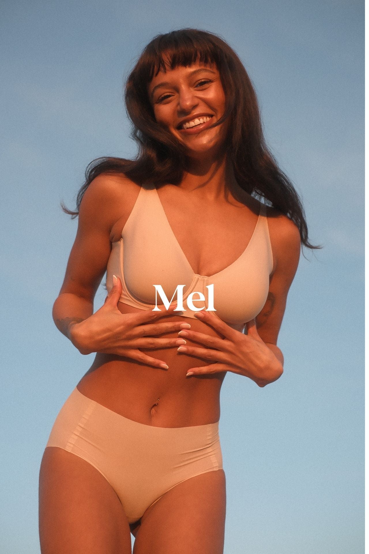 Photo of model called Mel wearing the new backsmoother bra and briefs set by Naturana